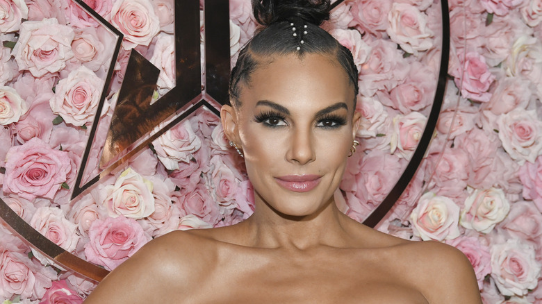 Amanza Smith in front of pink rose backdrop