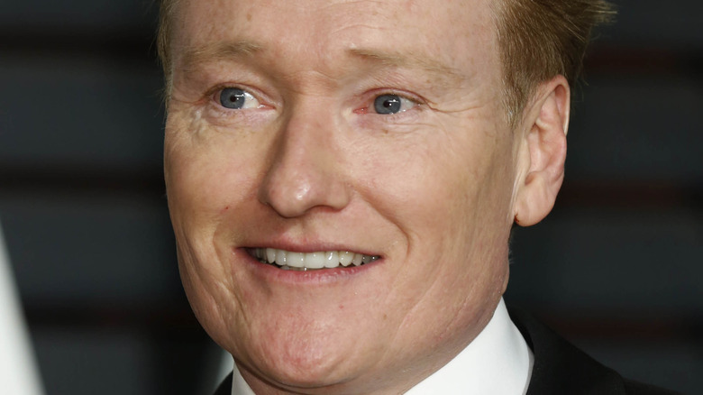 Conan O'Brien speaking at the Vanity Fair Oscar party 