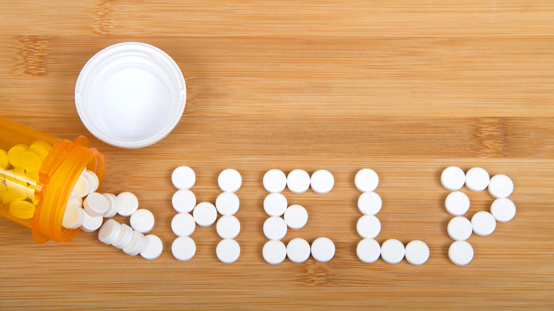 Pills spelling out the word "help"