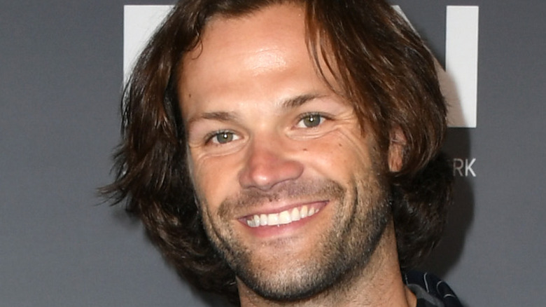 Jared Padalecki smiles on the red carpet