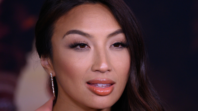 Jeannie Mai posing at event