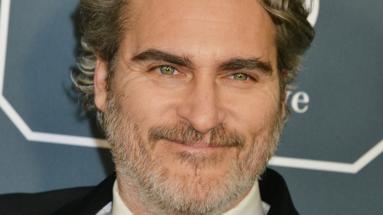 Joaquin Phoenix posing for a picture 