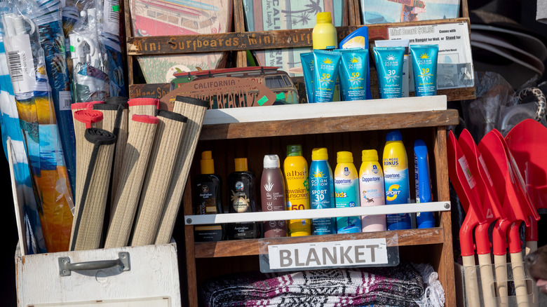 Box of summer supplies including sunscreen