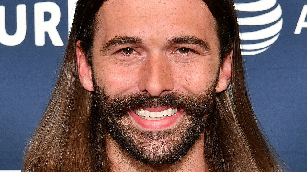 Jonathan Van Ness smiles with facial hair