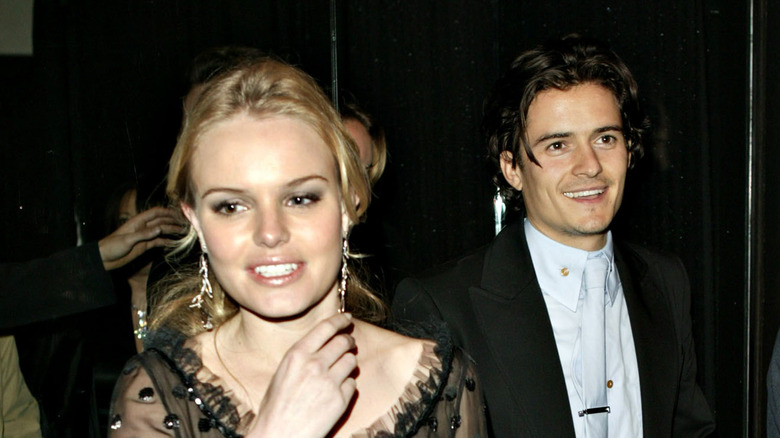 Kate Bosworth and Orlando Bloom walking together 