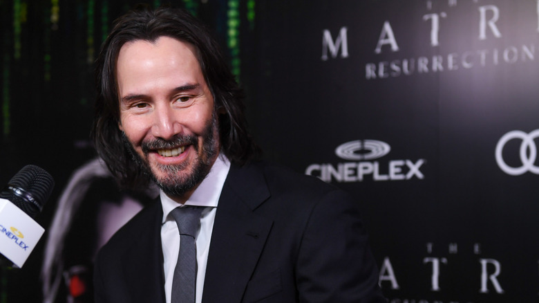 Keanu Reeves posing for a picture