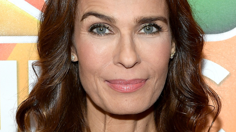 Kristian Alfonso with slight smile and raised eyebrow