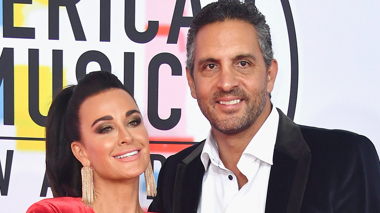Kyle Richards and Mauricio Umansky smile at an event