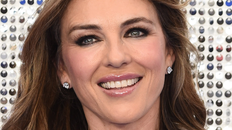 Liz Hurley poses with a smile.