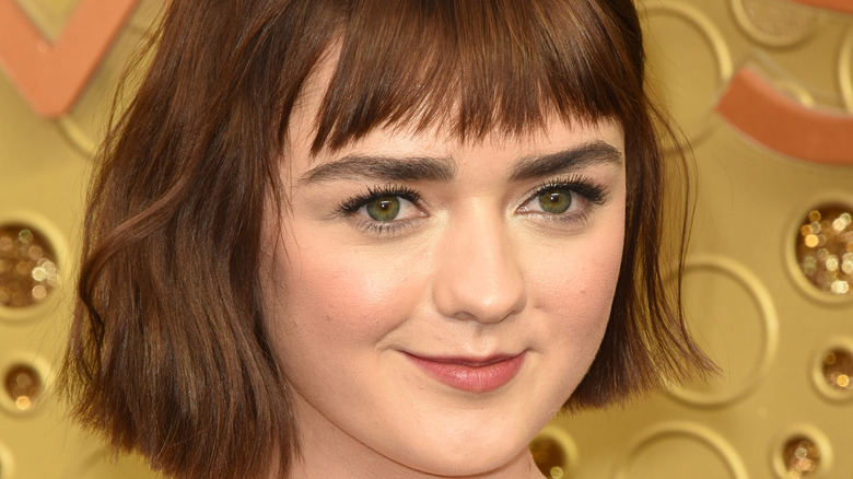 Maisie Williams smiling red hair bangs