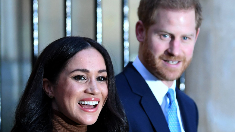 Duke and Duchess of Sussex smiling 