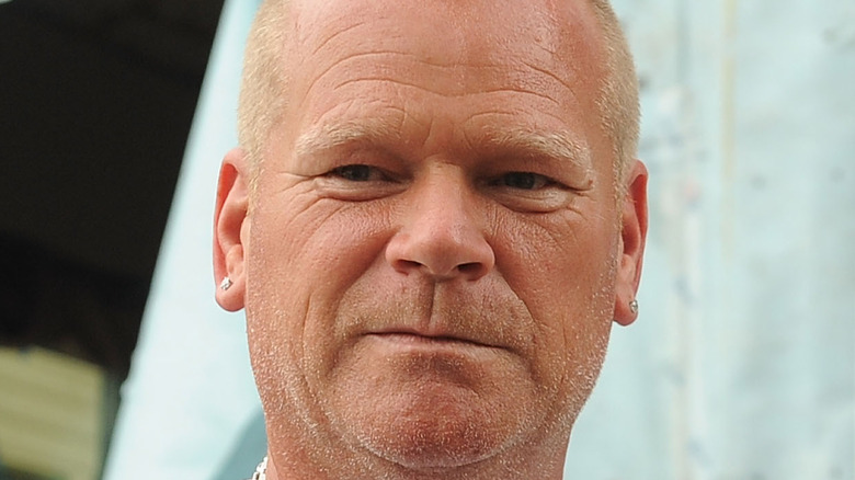 Mike Holmes poses at an event