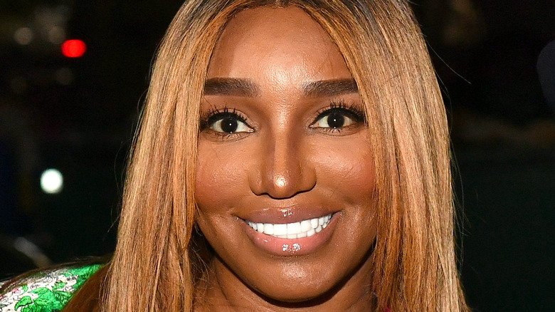 NeNe Leakes smiles with straight blonde hair