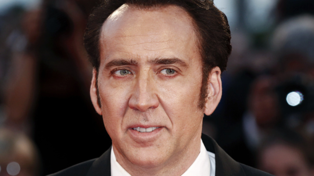 Nicolas Cage smiling film premiere