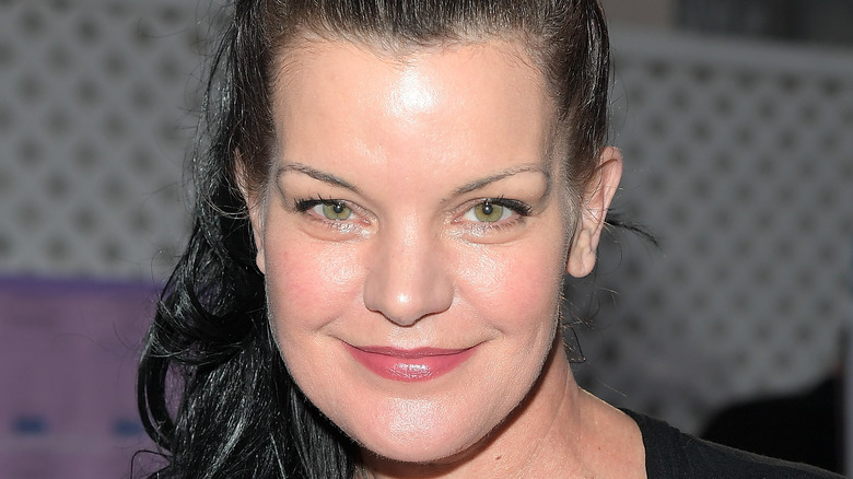 Pauley Perrette posing at event