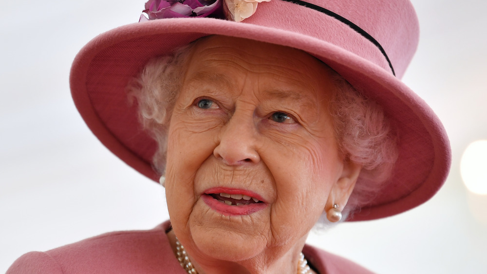 Queen Elizabeth wearing flower hat