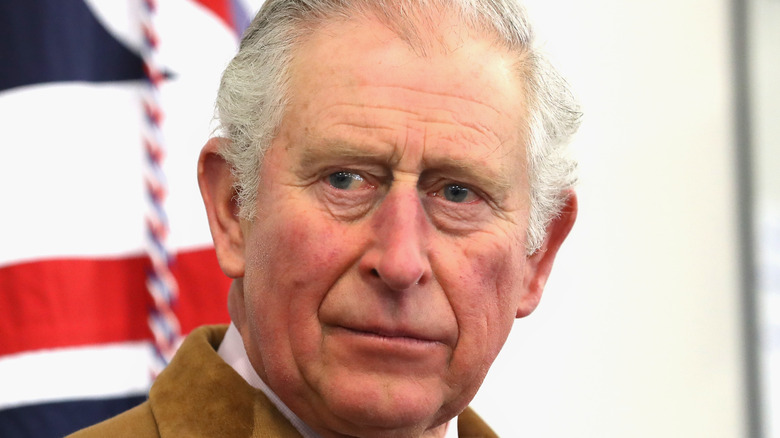 Prince Charles with the Union Jack in the background