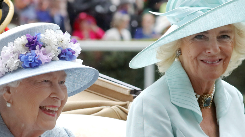 Queen Elizabeth and Camilla Parker Bowles on a carriage