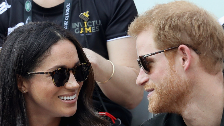 Prince Harry and Meghan Markle wear sunglasses