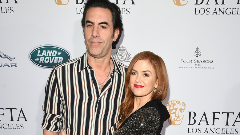 Sacha Baron Cohen and Isla Fisher smiling 