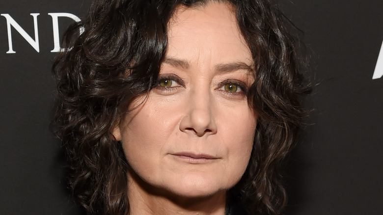 Sara Gilbert gives a stern look with dark eye makeup.