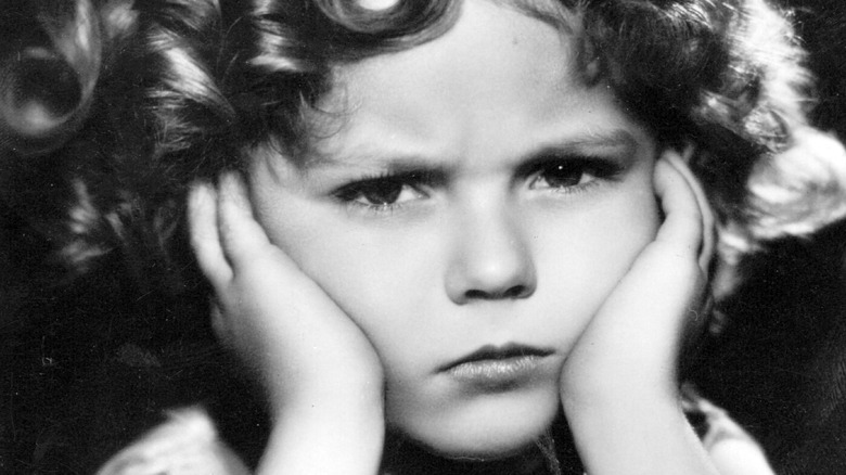 Shirley Temple looking unhappy