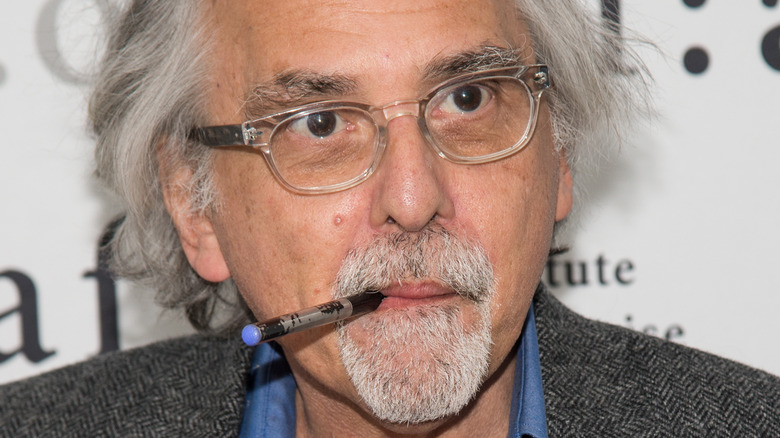 Close up of Art Spiegelman with marker sticking out of his mouth