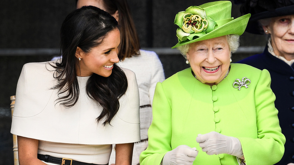 Queen Elizabeth and Meghan Markle laughing