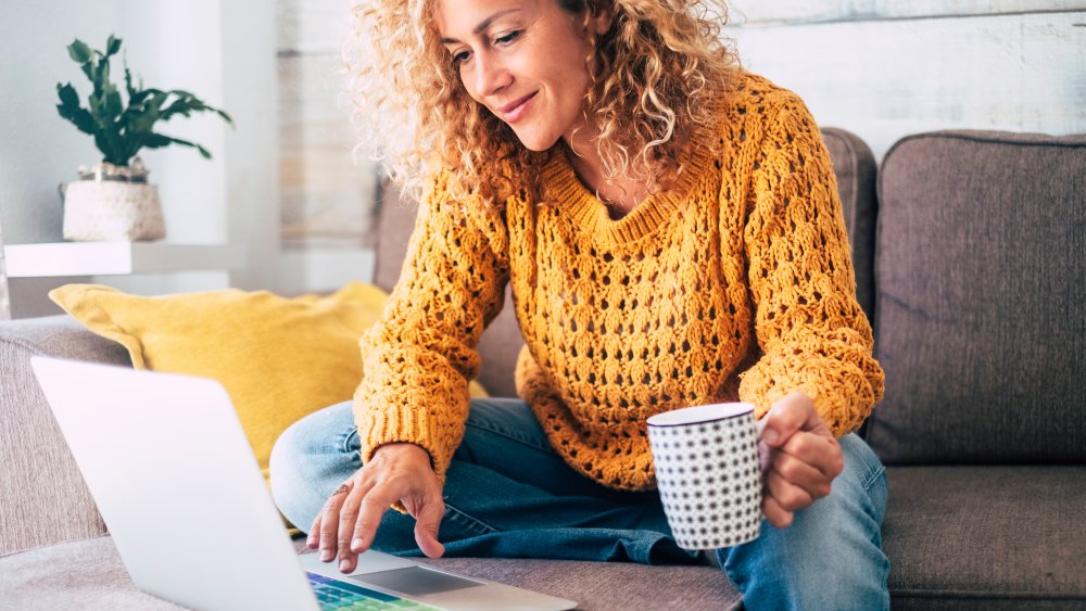 woman on laptop with a mug of coffee