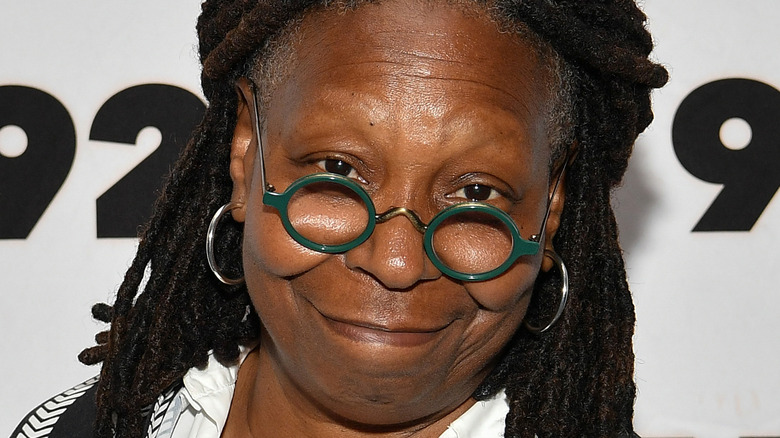 Whoopi Goldberg smiling on the red carpet