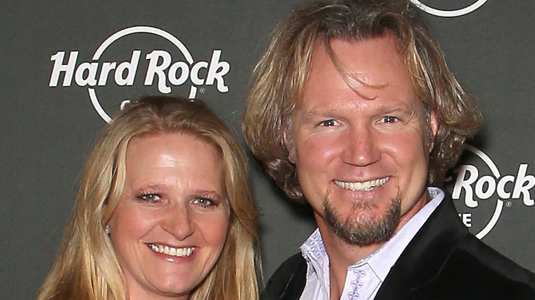 Kody and Christine Brown smiling on red carpet 