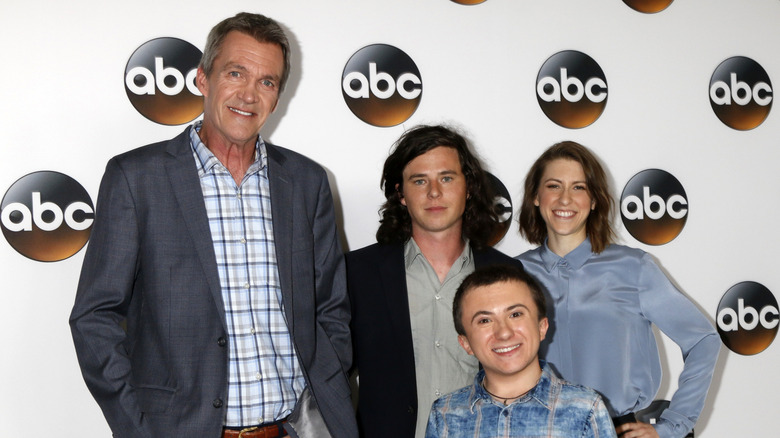 "The Middle" cast smiling on step-and-repeat