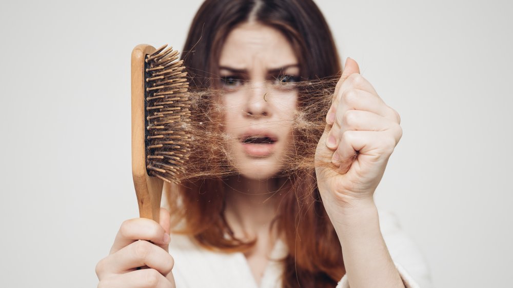 woman brushing hair