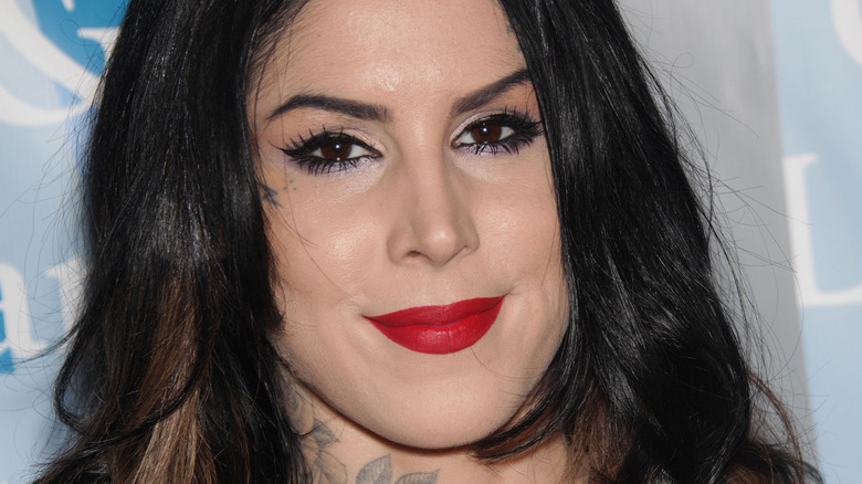 Kat Von D smiles at an event