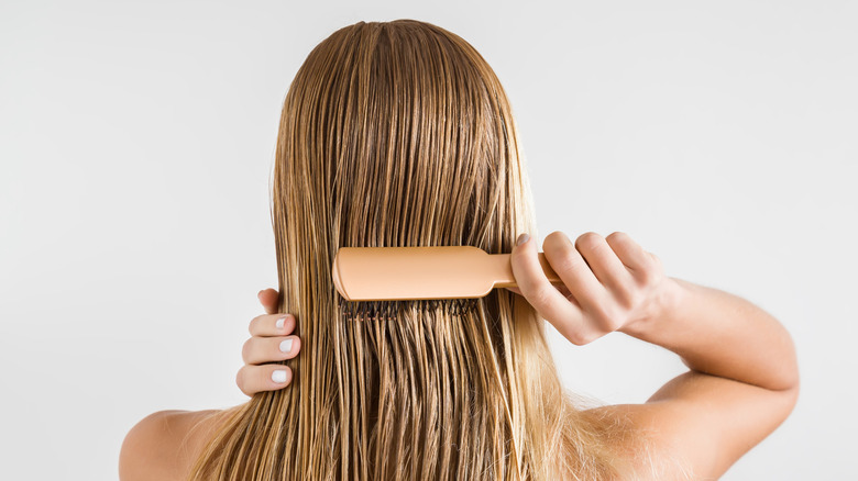 Woman brushing her hair