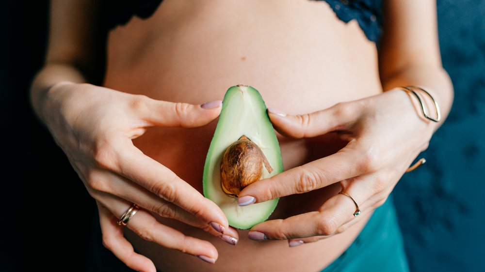 avocado on pregnant belly