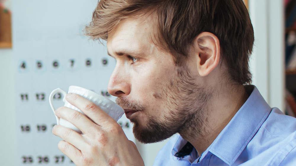 Man drinking coffee