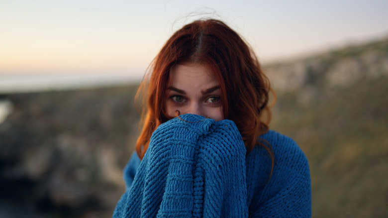 woman cold with a blanket
