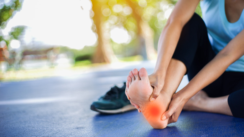Woman with foot pain during exercise