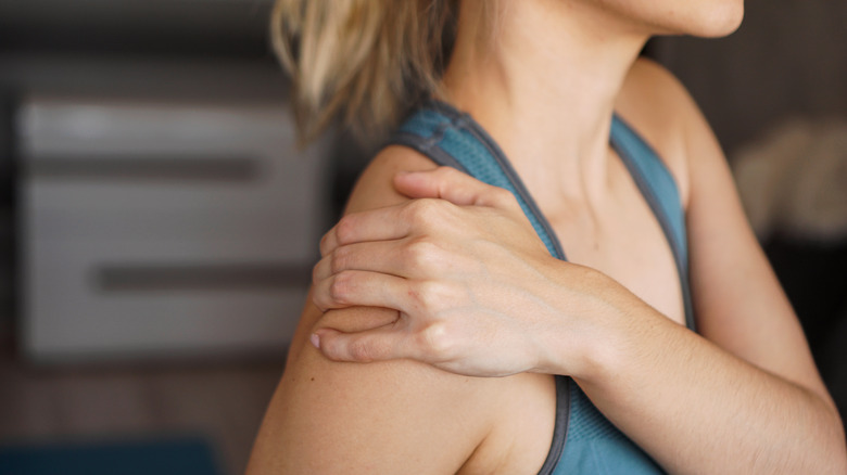 Woman experiencing shoulder pain