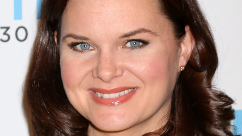 Heather Tom poses with a smile