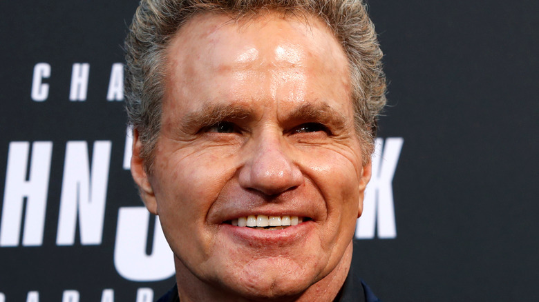 Martin Kove poses on the red carpet for John Wick