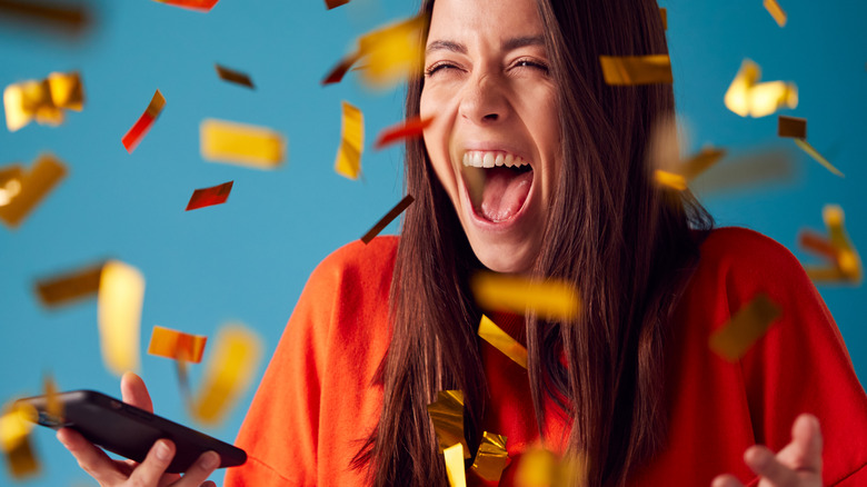 Woman excited winning a prize