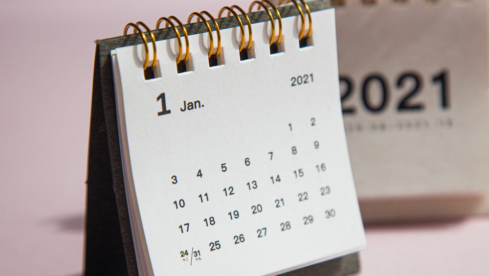 paper calendar with a pink background 