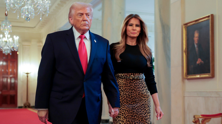 Donald and Melania Trump leopard skirt walking holding hands