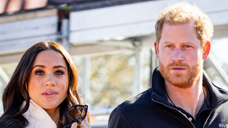 Prince Harry and Meghan Markle walking