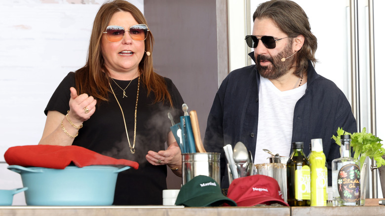 Rachael Ray and John M. Cusimano in front of cooking ingredients