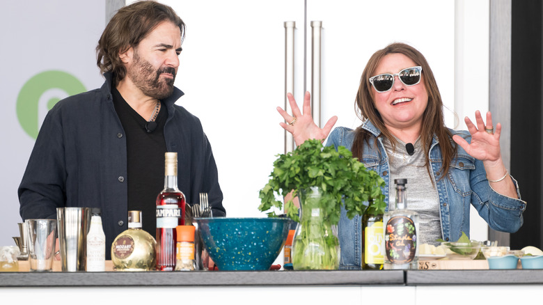 John M. Cusimano and Rachael Ray in front of cooking ingredients