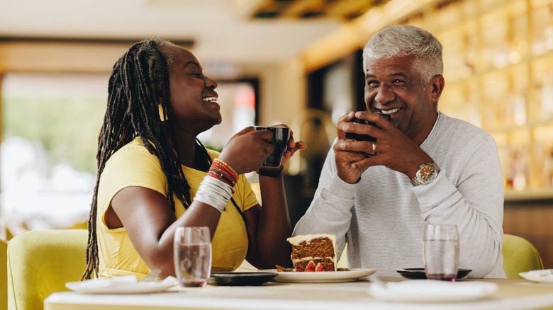 middle-aged couple chatting drinking coffee