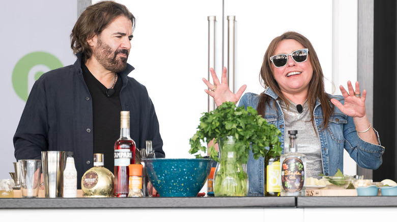 John M. Cusimano and Rachael Ray in front of cooking ingredients